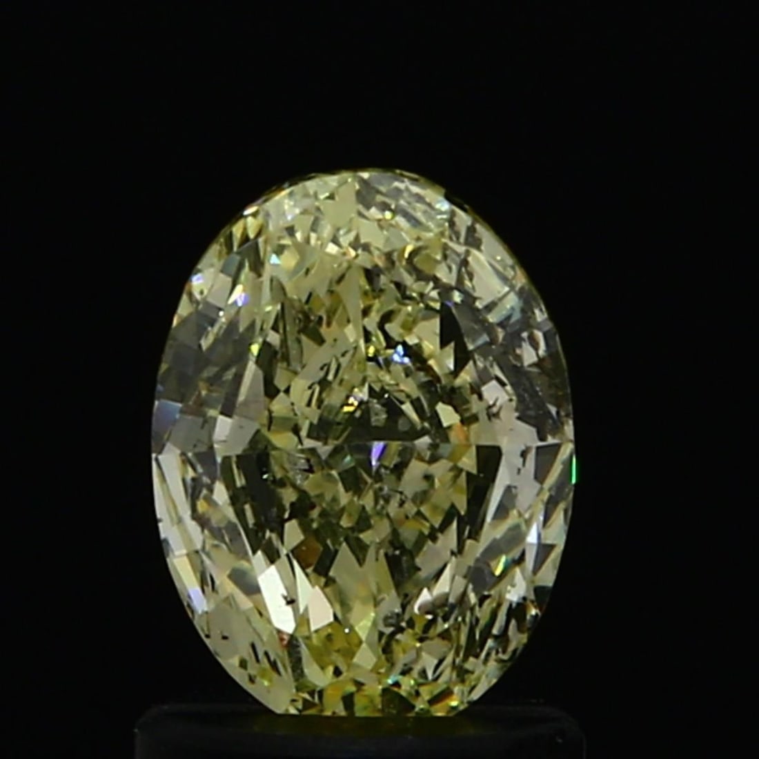 Loose Diamond - OVAL 0.79ct Fancy Light Yellow: Loose Diamond - OVAL 0.79ct Fancy Light Yellow Source: Natural Shape: OVAL Carats: 0.79 Color: Fancy Light Yellow Certification: GIA Video: