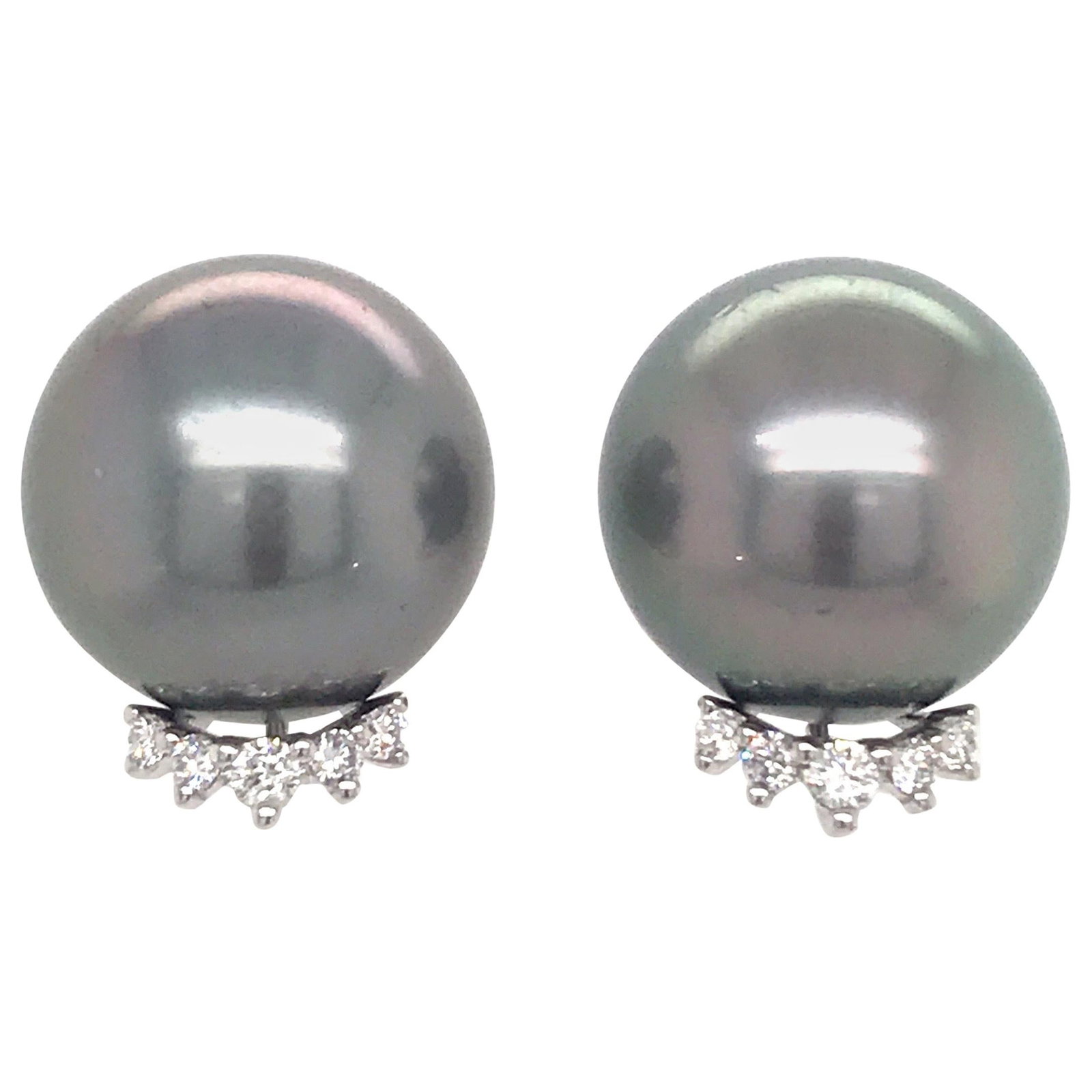 18K White Gold Stud Earrings with Tahitian Pearls and 0.24 Carat Diamonds: 18K White Gold Stud Earrings with Tahitian Pearls and 0.24 Carat Diamonds Contemporary stud earrings in 18K white gold, set with two gray Tahitian pearls and accented by round brilliant-cut diamonds. 