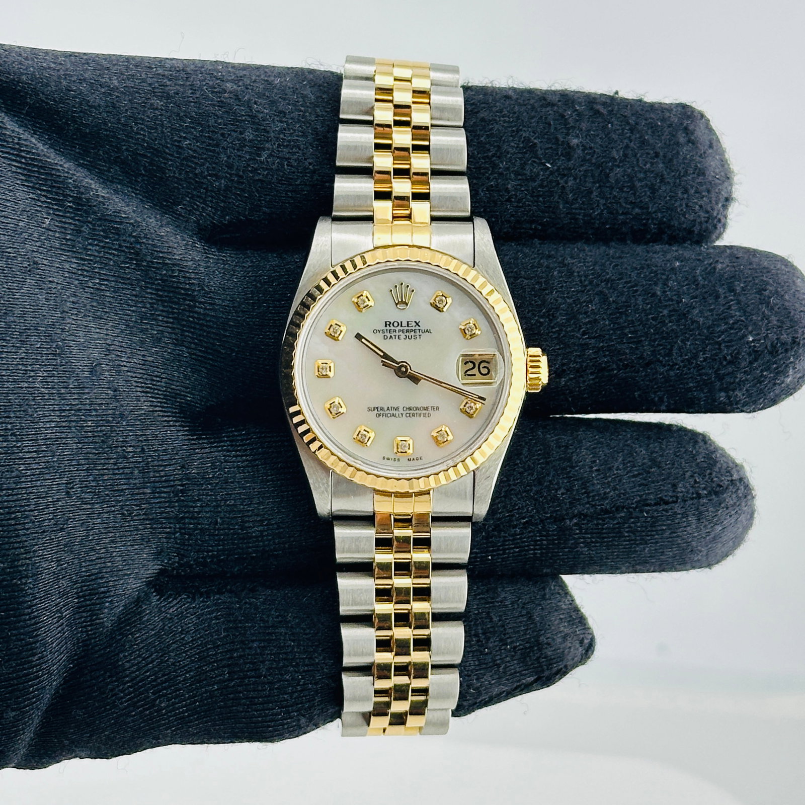 Rolex Datejust 68273 ladies watch aftermarket white MOP diamond dial papers 1993: Rolex Datejust 68273 ladies watch aftermarket white MOP diamond dial papers 1993 This ladies Rolex Datejust watch features a champagne stick dial, a fluted bezel, and is paired with a D-Link Jubilee b