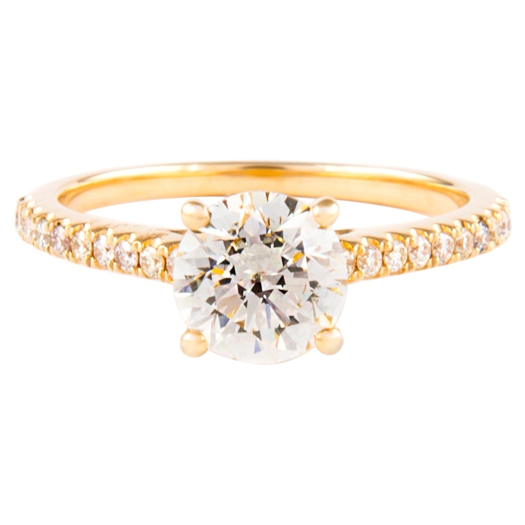 18k Yellow Gold EGL Diamond Ring 1.20 Carat Round Brilliant: 18k Yellow Gold EGL Diamond Ring 1.20 Carat Round Brilliant EGL certified contemporary solitaire-style diamond ring featuring a 1.20 carat round brilliant center diamond accented by additional round b