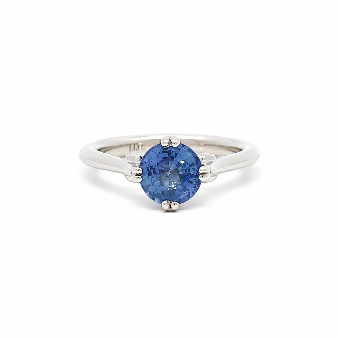 18k White Gold Solitaire Ring with 1.21ct Cornflower Blue Sapphire: 18k White Gold Solitaire Ring with 1.21ct Cornflower Blue Sapphire Pre-owned solitaire ring crafted in solid 18k white gold and set with one natural genuine cornflower blue sapphire in a round brillia