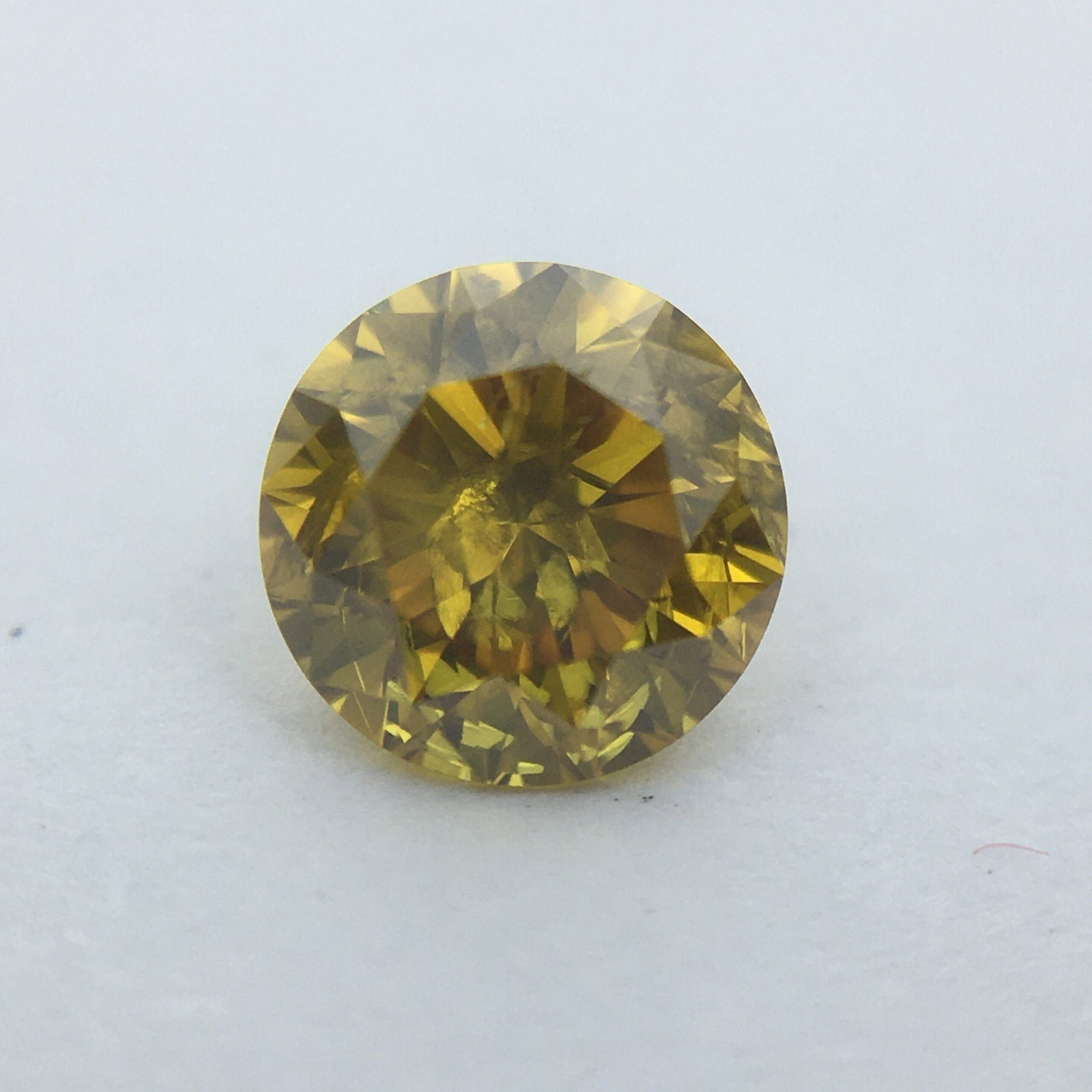 Loose Diamond - ROUND 0.39ct Fancy Deep Brownish Orangey Yellow I2: Loose Diamond - ROUND 0.39ct Fancy Deep Brownish Orangey Yellow I2 Source: Natural Shape: ROUND Carats: 0.39 Color: Fancy Deep Brownish Orangey Yellow Certification: GIA PLEASE NOTE: Framed, Large, or