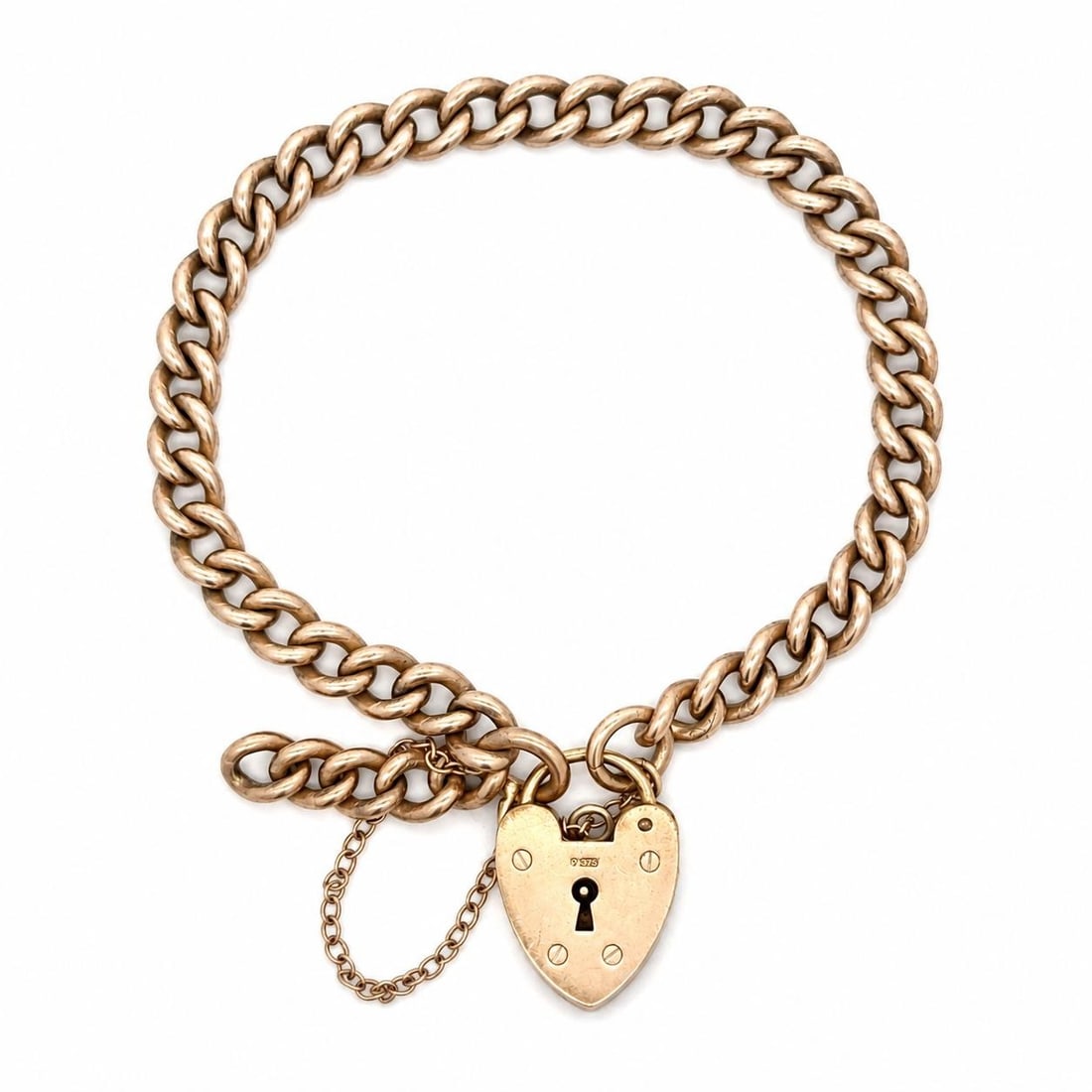 Victorian 9k Yellow Gold Curb Link Bracelet Heart Padlock Clasp: Victorian 9k Yellow Gold Curb Link Bracelet Heart Padlock Clasp Antique Victorian curb link bracelet crafted in solid 9k rosy yellow gold and finished with a heart padlock clasp. This pre-owned bracel