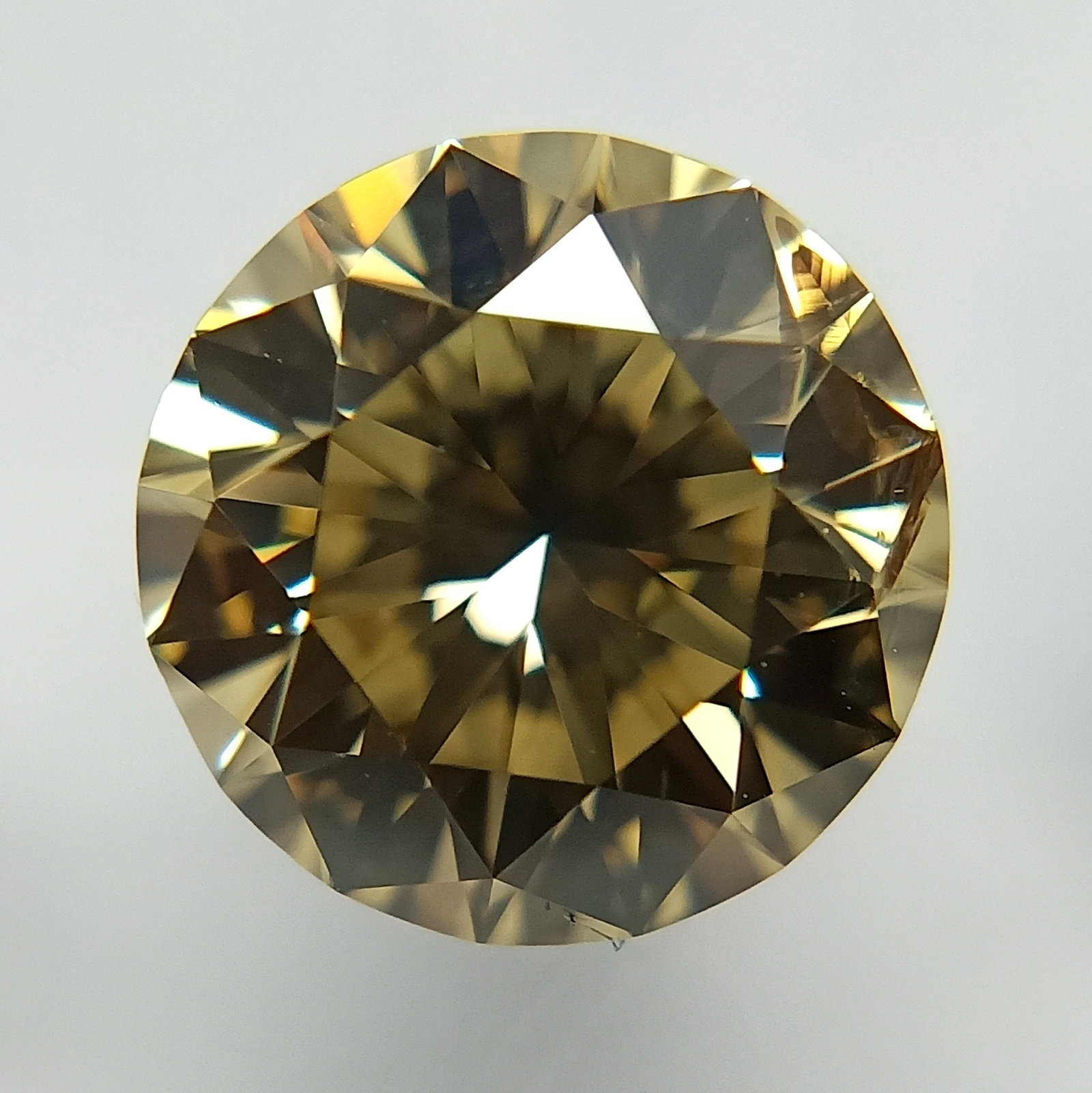 Loose Diamond - ROUND 1.53ct Fancy Brownish Yellow: Loose Diamond - ROUND 1.53ct Fancy Brownish Yellow Source: Natural Shape: ROUND Carats: 1.53 Color: Fancy Brownish Yellow Certification: GIA PLEASE NOTE: Framed, Large, or heavy items do not have