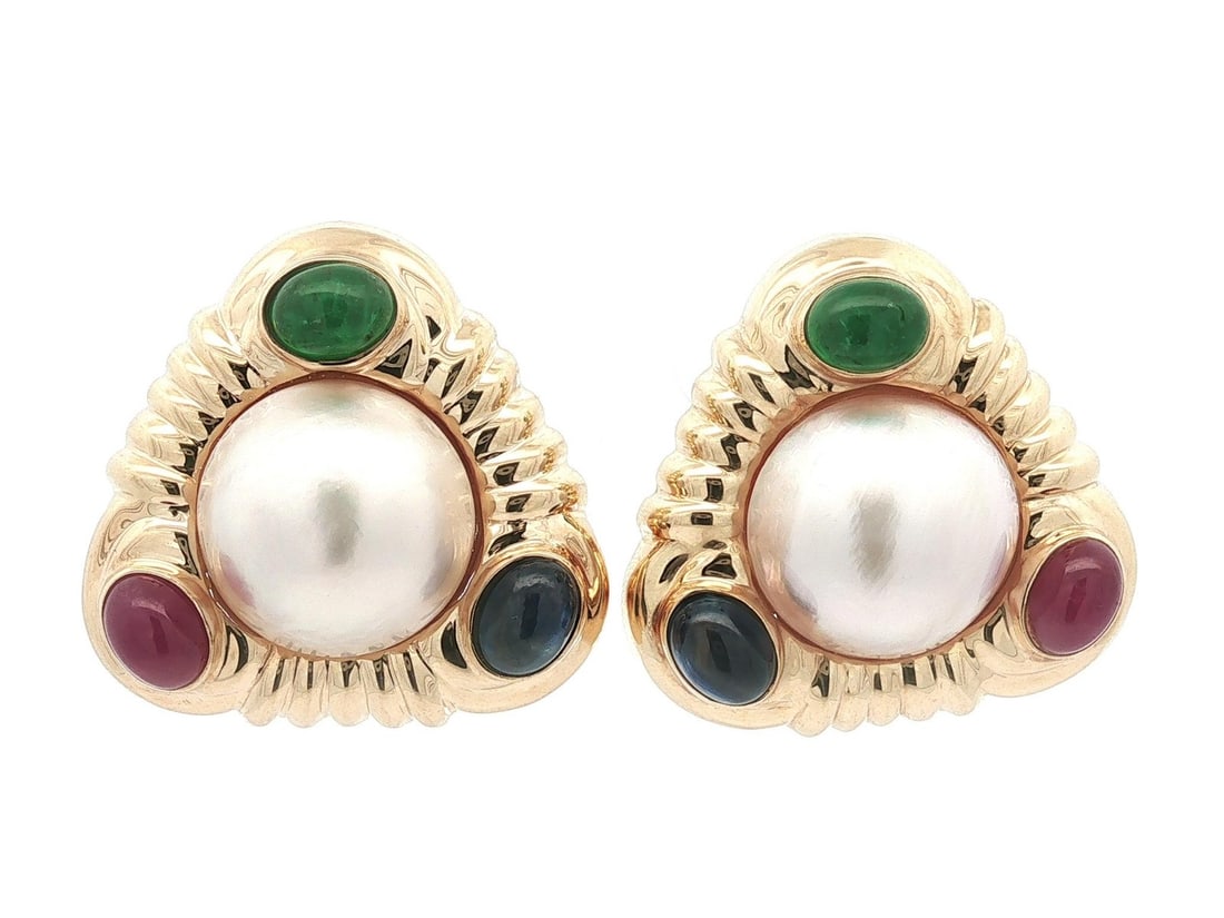 Triangle Clip-On Earrings 14k Yellow Gold Mabe Pearl Ruby Sapphire Emerald: Triangle Clip-On Earrings 14k Yellow Gold Mabe Pearl Ruby Sapphire Emerald Large clip-on earrings featuring cultured mabe pearls accented by sapphires, rubies, and emeralds in a triangular design. Cra