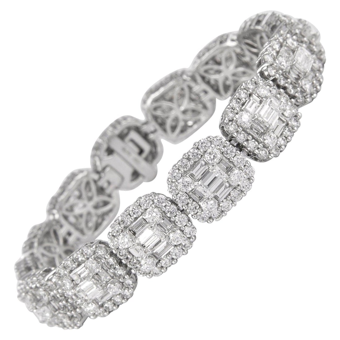 Diamond Bracelet 15.40ct 18k White Gold Illusion Set: Diamond Bracelet 15.40ct 18k White Gold Illusion Set Modern illusion-set diamond bracelet in 18k white gold, featuring natural round and baguette cut diamonds arranged to create the look of emerald cu