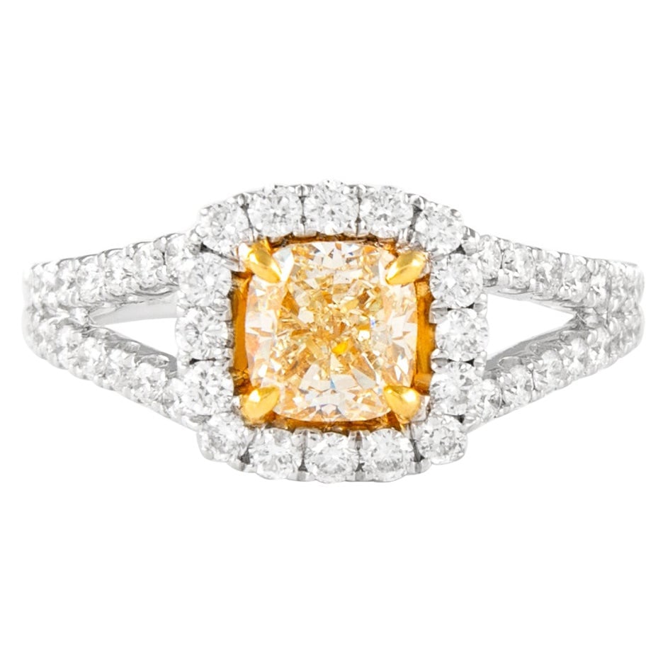 18k Two Tone Fancy Yellow VS1 Cushion Diamond Halo Ring: 18k Two Tone Fancy Yellow VS1 Cushion Diamond Halo Ring Contemporary diamond ring featuring a Fancy Yellow cushion-cut center diamond in a halo setting with additional round brilliant diamonds. Crafte