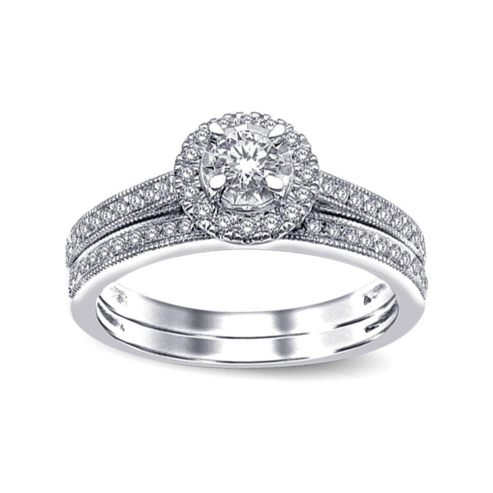 10K White Gold 1/2 Ct.tw Diamond Bridal Ring: 10K White Gold 1/2 Ct.tw Diamond Bridal Ring This amazing Bridal Ring is available in 10K White Gold. There is 1 round diamond with a total carat weight of 1/2 Ct.Tw. set in a micro prong setting. 10k