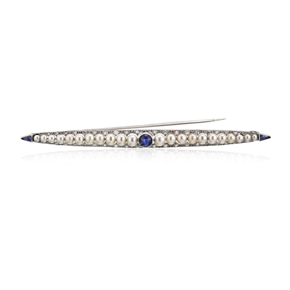 Platinum Bar Brooch with 3 Sapphires 22 Pearls and 44 Diamonds: Platinum Bar Brooch with 3 Sapphires 22 Pearls and 44 Diamonds Pre-owned platinum bar pin brooch set with sapphires, pearls, and diamonds. This piece features a classic linear design with a central sa