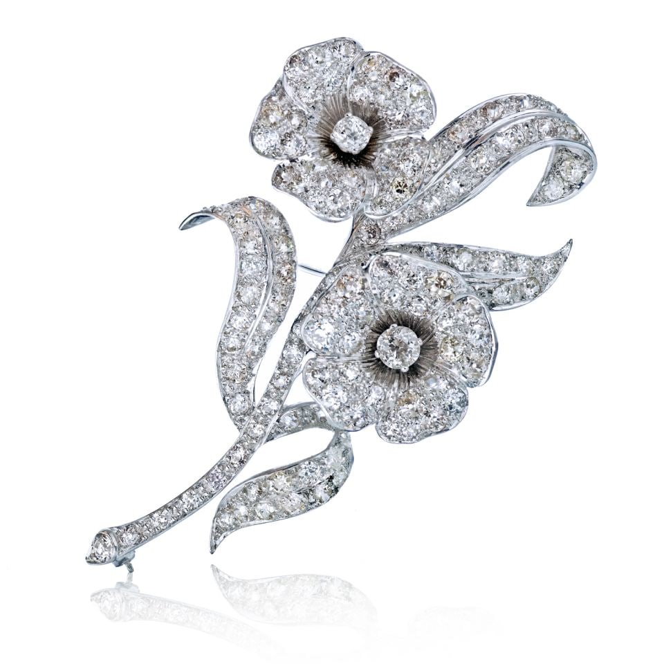 Platinum Flower Brooch with 20 Carats of Diamonds: Platinum Flower Brooch with 20 Carats of Diamonds This exquisite Flower Platinum Moving Flower Heads Brooch is a stunning piece of jewelry crafted from fine platinum. It features approximately 20 cara