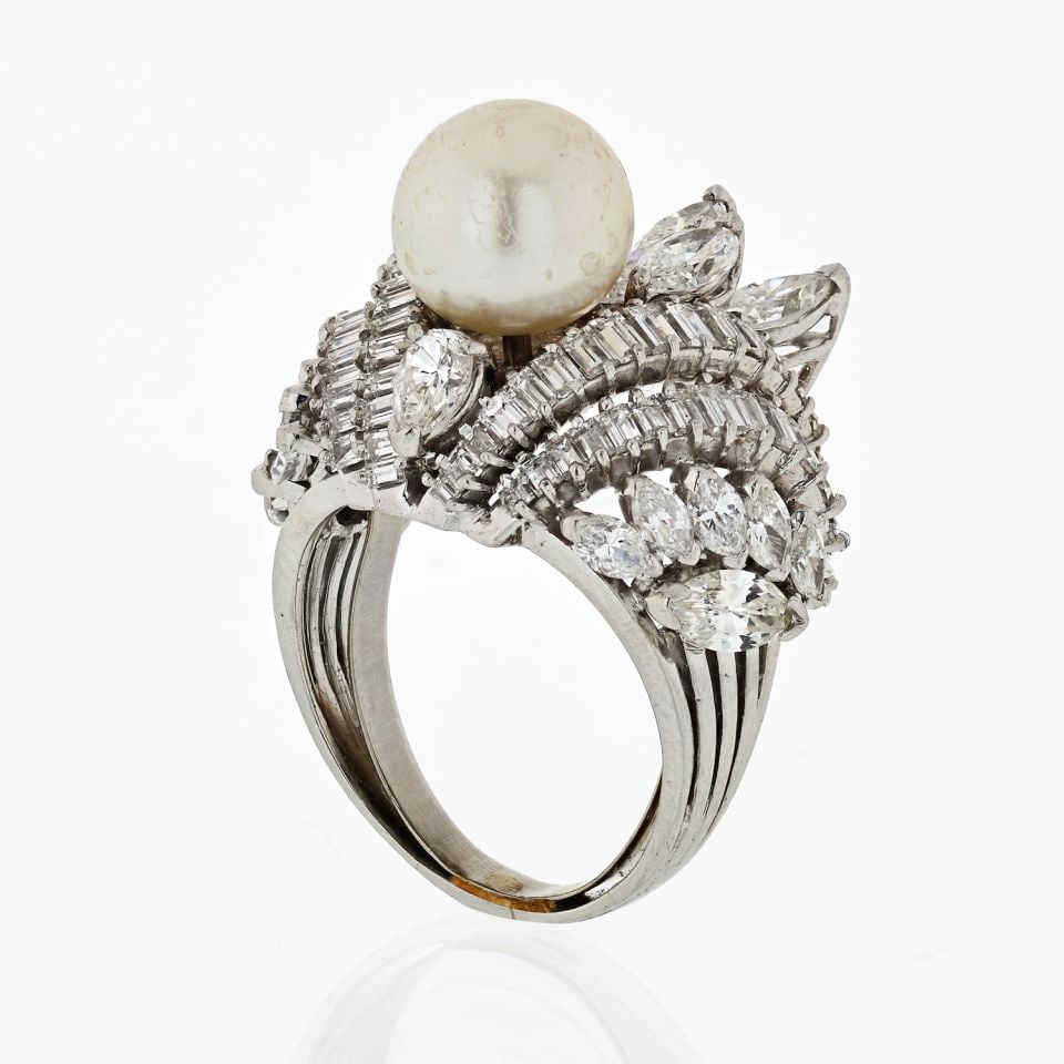 Estate platinum pearl cluster ring with 10 ct diamonds 1950s: Estate platinum pearl cluster ring with 10 ct diamonds 1950s Estate ring from the 1950s crafted in platinum, featuring an approximate 10 carats of diamonds in marquise, baguette, and pear shapes surro