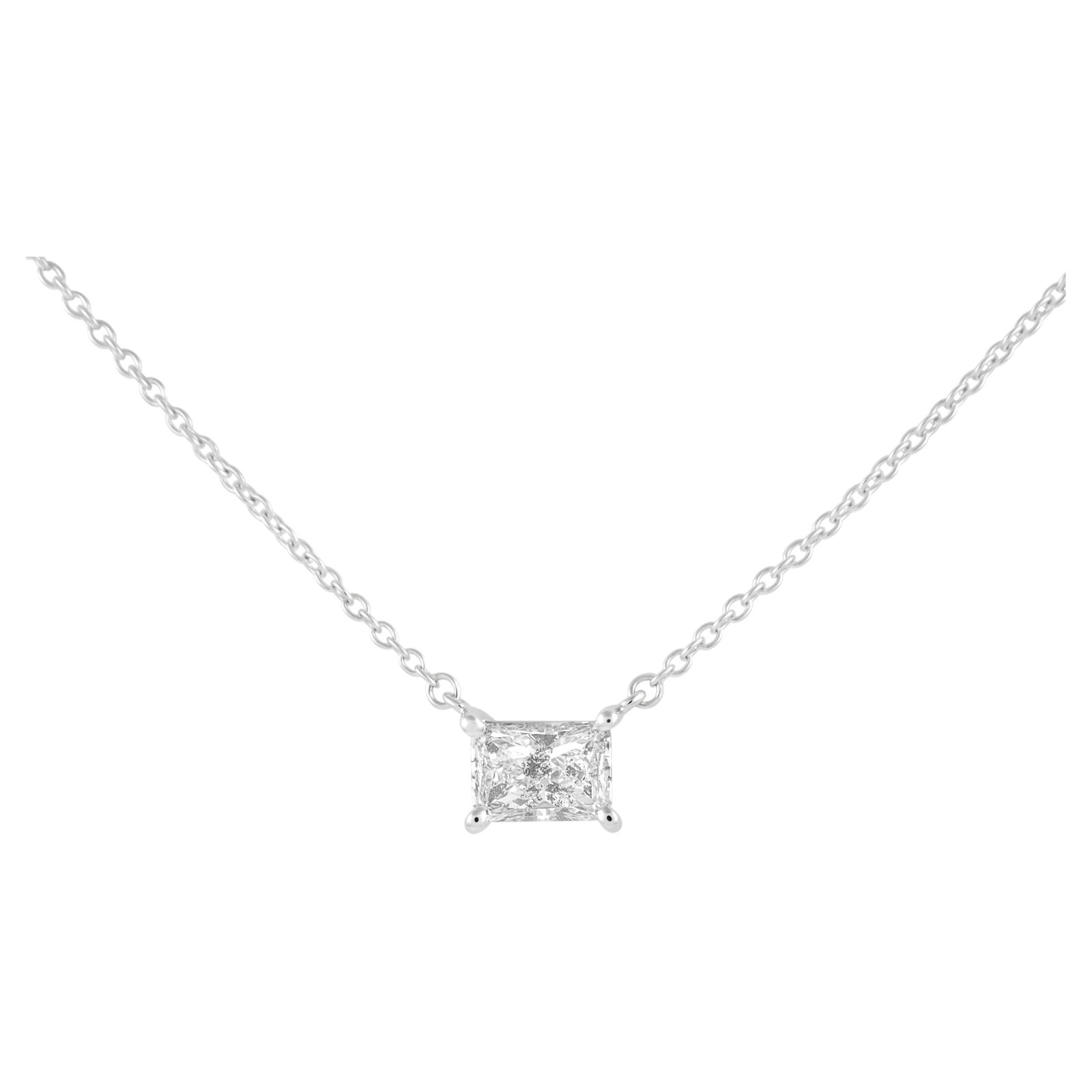 Radiant Cut 1.01ct Diamond Pendant 14k Yellow Gold: Radiant Cut 1.01ct Diamond Pendant 14k Yellow Gold Classic solitaire pendant necklace featuring a 1.01 ct radiant cut white diamond set in 14k yellow gold. This modern 21st-century piece has a clean, 