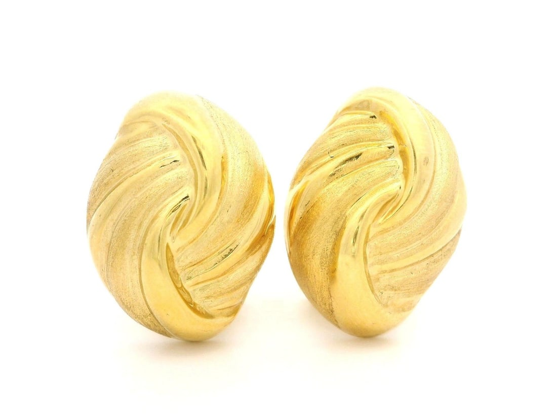 Omega Italian 18k Yellow Gold Button Earrings Twist Dual Finish: Omega Italian 18k Yellow Gold Button Earrings Twist Dual Finish Italian-made omega earrings crafted in solid 18k yellow gold with a twist-look puffed button design and dual finish. Designed for pierce