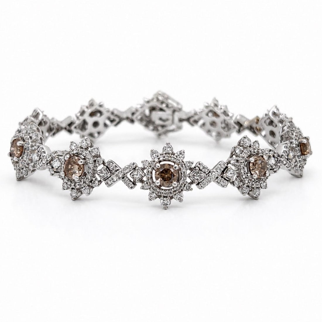 Diamond Bracelet in 18K White Gold 10.30 Ct 6.5 Inches: Diamond Bracelet in 18K White Gold 10.30 Ct 6.5 Inches Pre-owned diamond bracelet crafted in 18K white gold and set with champagne diamonds and additional diamonds. The bracelet features a substantial