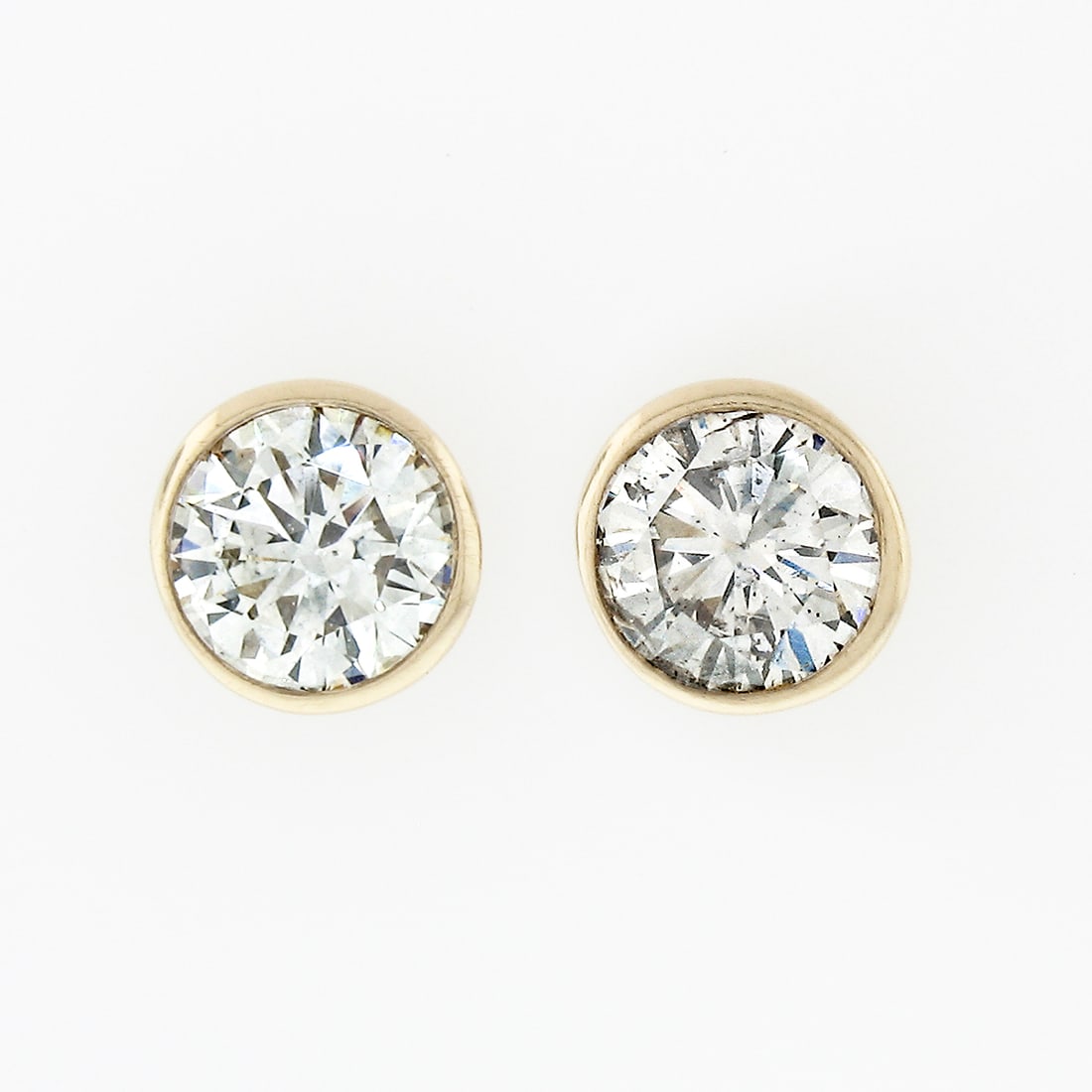Bezel Set Diamond Stud Earrings 14k Yellow Gold 0.54ctw Round Brilliant: Bezel Set Diamond Stud Earrings 14k Yellow Gold 0.54ctw Round Brilliant Un-used classic diamond stud earrings crafted in solid 14k yellow gold. This pair features two natural round brilliant cut diamo