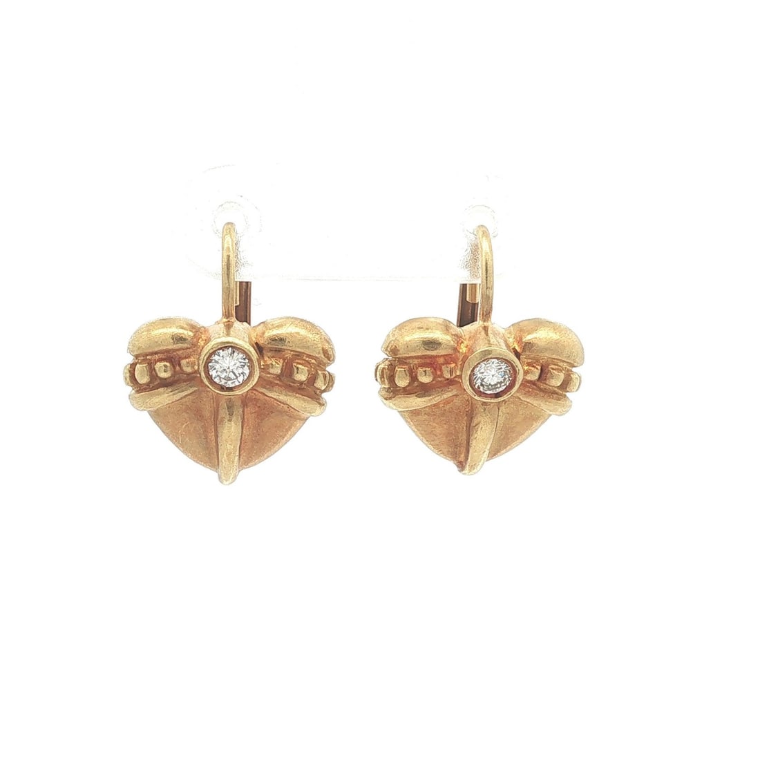 18k Yellow Gold Heart Drop Earrings with Diamonds and Leverback Closures: 18k Yellow Gold Heart Drop Earrings with Diamonds and Leverback Closures Vintage dangle/drop earrings featuring puffed heart drops accented with natural round brilliant cut diamonds in bezel settings.