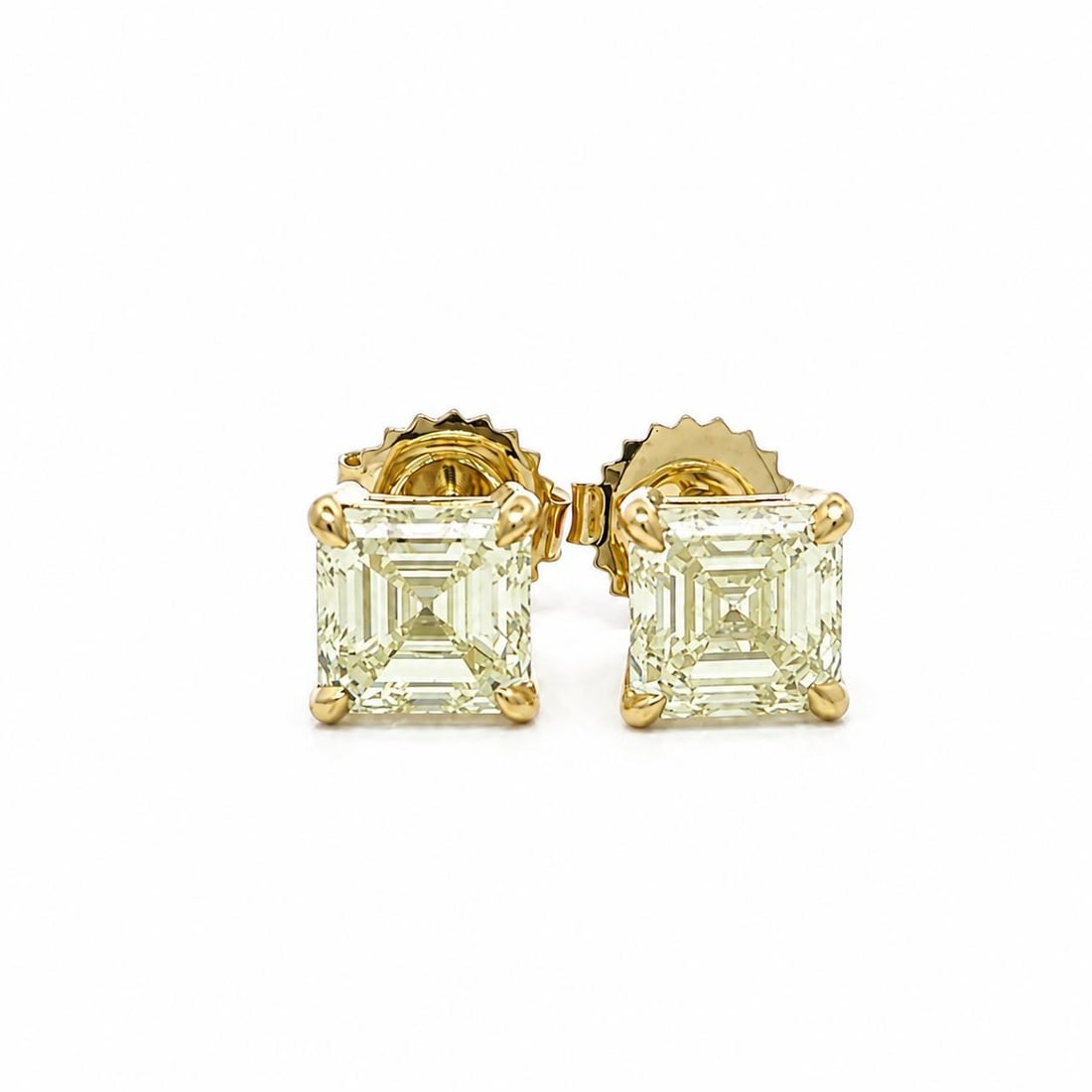 GIA 3.01ctw Square Emerald Cut Diamond Stud Earrings in 18k Yellow Gold: GIA 3.01ctw Square Emerald Cut Diamond Stud Earrings in 18k Yellow Gold Un-used diamond stud earrings crafted in solid 18k yellow gold and set with two natural genuine square emerald cut diamonds. The