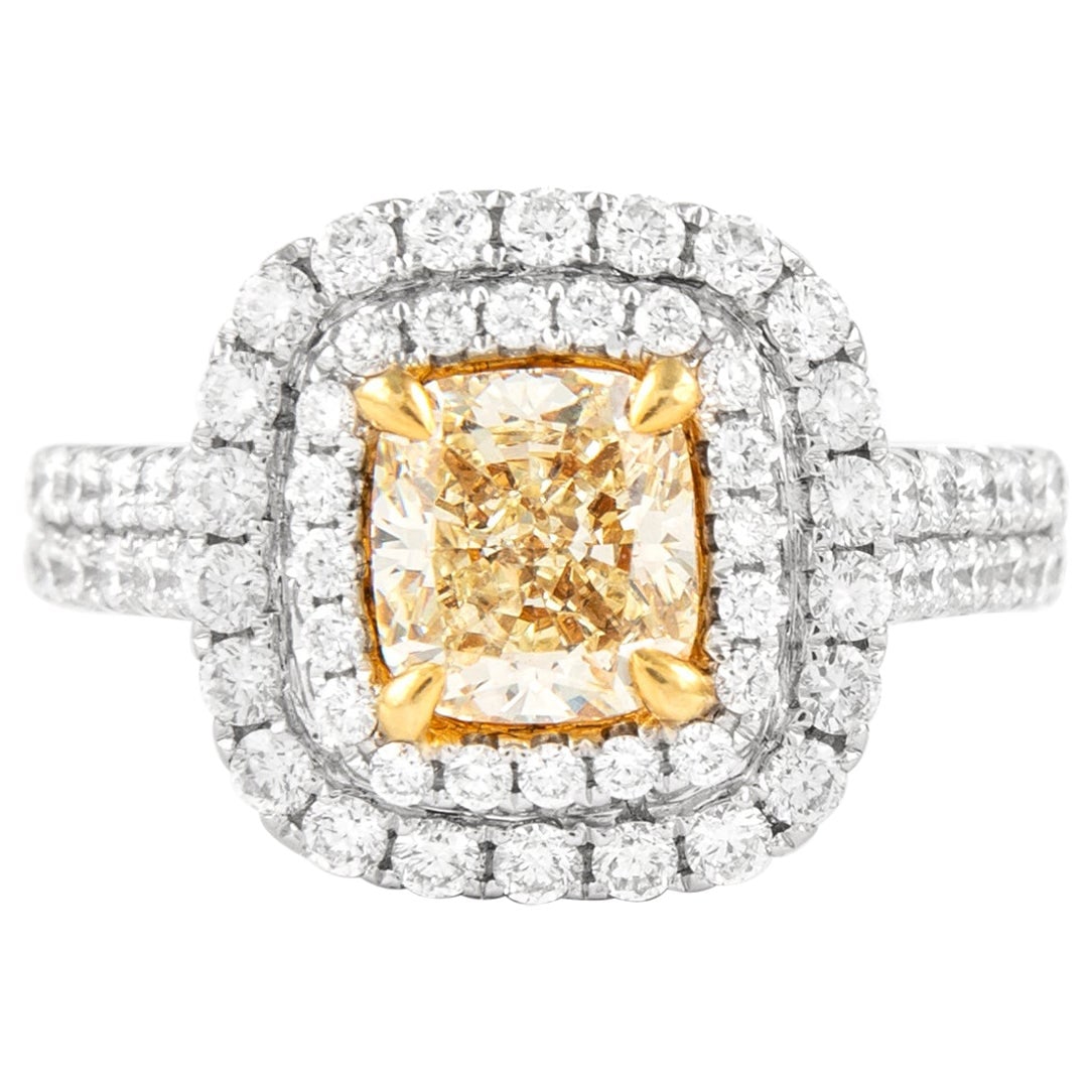 Fancy Intense Yellow VS2 Diamond Ring in 18k Gold: Fancy Intense Yellow VS2 Diamond Ring in 18k Gold Contemporary double halo ring featuring a 1.50 ct cushion cut Fancy Intense Yellow VS2 diamond, accented by 104 round brilliant diamonds totaling 1.16