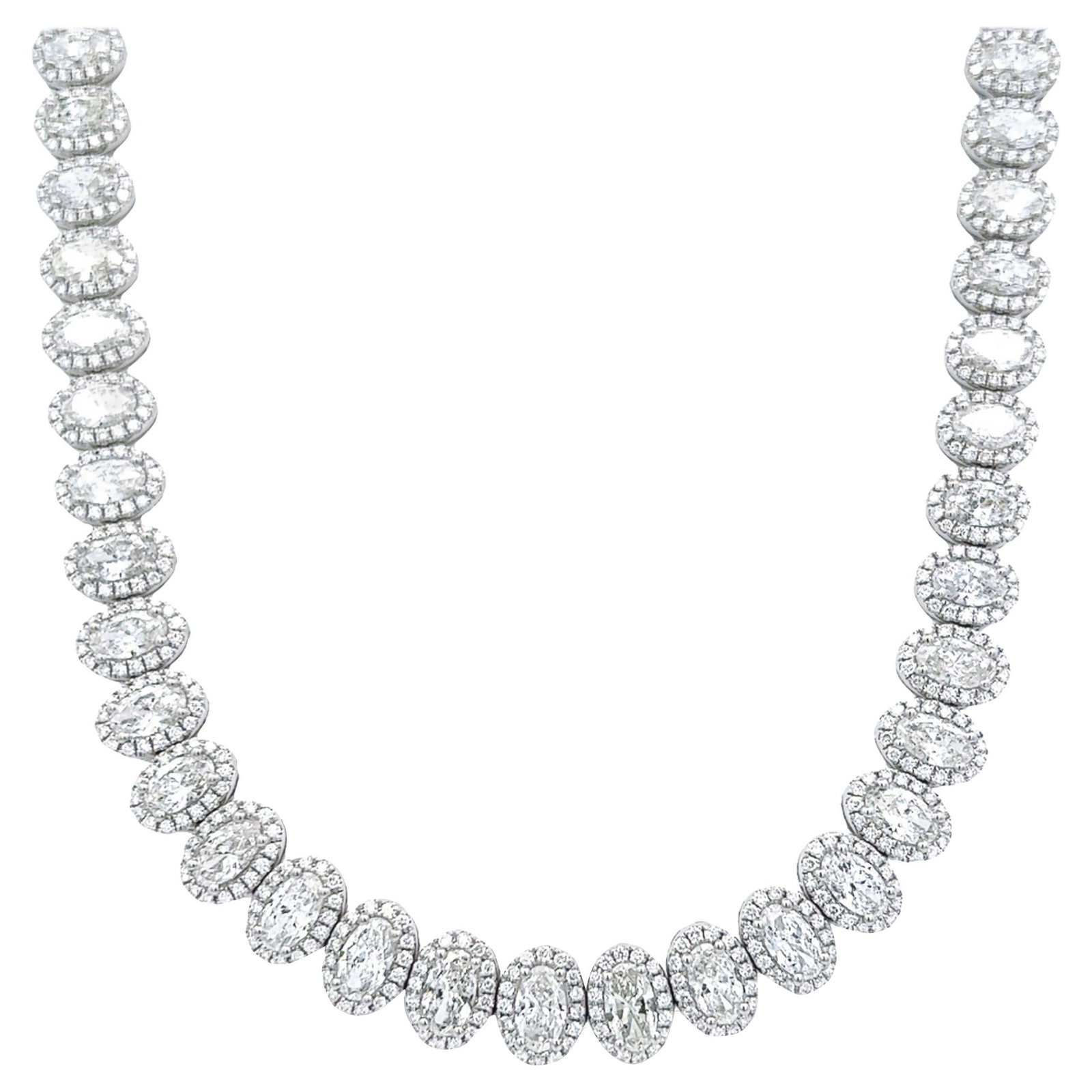 24.22ct Diamond Tennis Necklace 18k White Gold Halo: 24.22ct Diamond Tennis Necklace 18k White Gold Halo Contemporary oval diamond tennis necklace with halo detailing in 18k white gold. This necklace features 60 natural oval-cut diamonds set east-west a