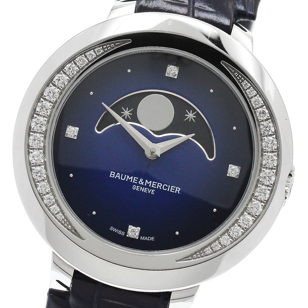 Baume & Mercier Promesse M0A10347 Women's Moon Phase Diamond Bezel Watch: Baume & Mercier Promesse M0A10347 Women's Moon Phase Diamond Bezel Watch Baume & Mercier Promesse wristwatch with a diamond-set bezel and moon phase display. This quartz model features a blue dial, st