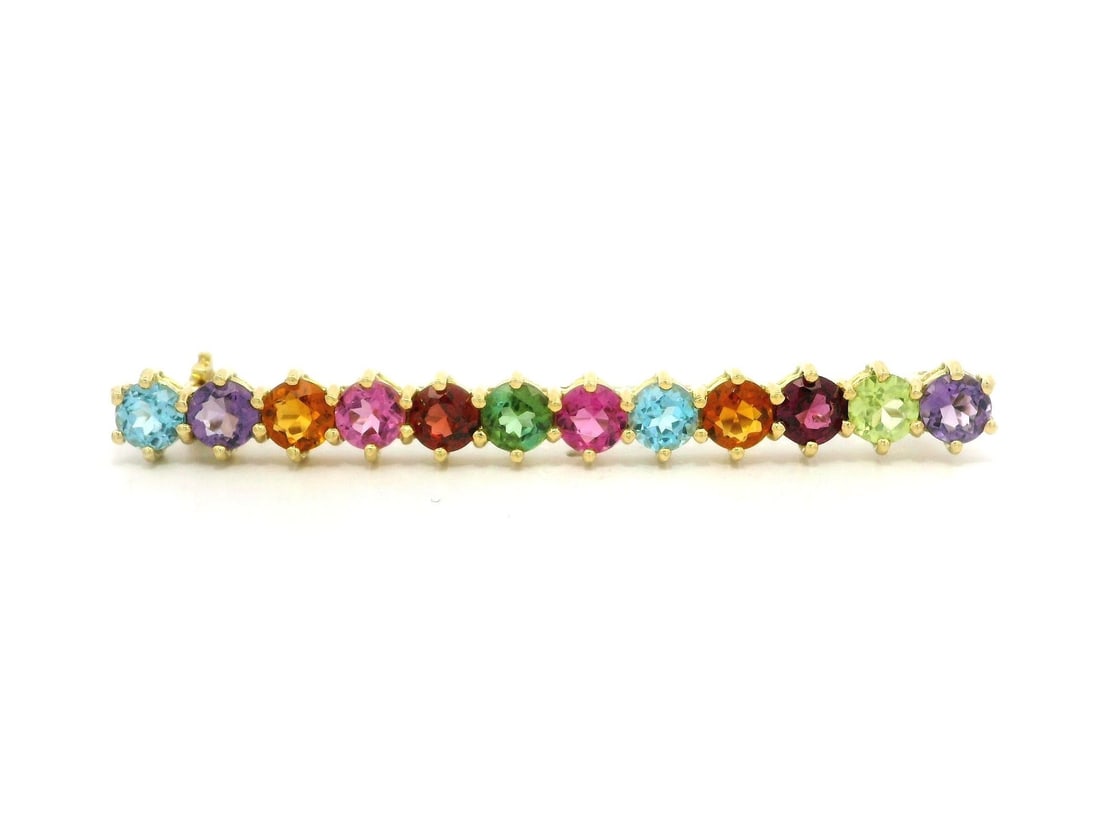 18k Yellow Gold Multi Color Gemstone Bar Pin Brooch: 18k Yellow Gold Multi Color Gemstone Bar Pin Brooch This exquisite brooch features a solid 18k yellow gold construction adorned with twelve vivid round natural gemstones. Each gemstone, measuring appr