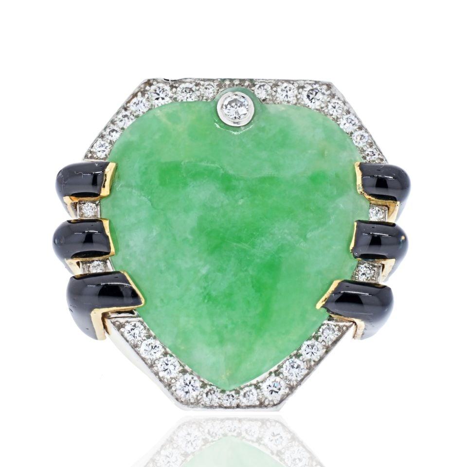 David Webb Jade Diamond Black Enamel Ring in 18K Yellow Gold: David Webb Jade Diamond Black Enamel Ring in 18K Yellow Gold Estate statement ring by David Webb, crafted in 18K yellow gold and set with a large natural jade, diamonds, and black enamel accents. This