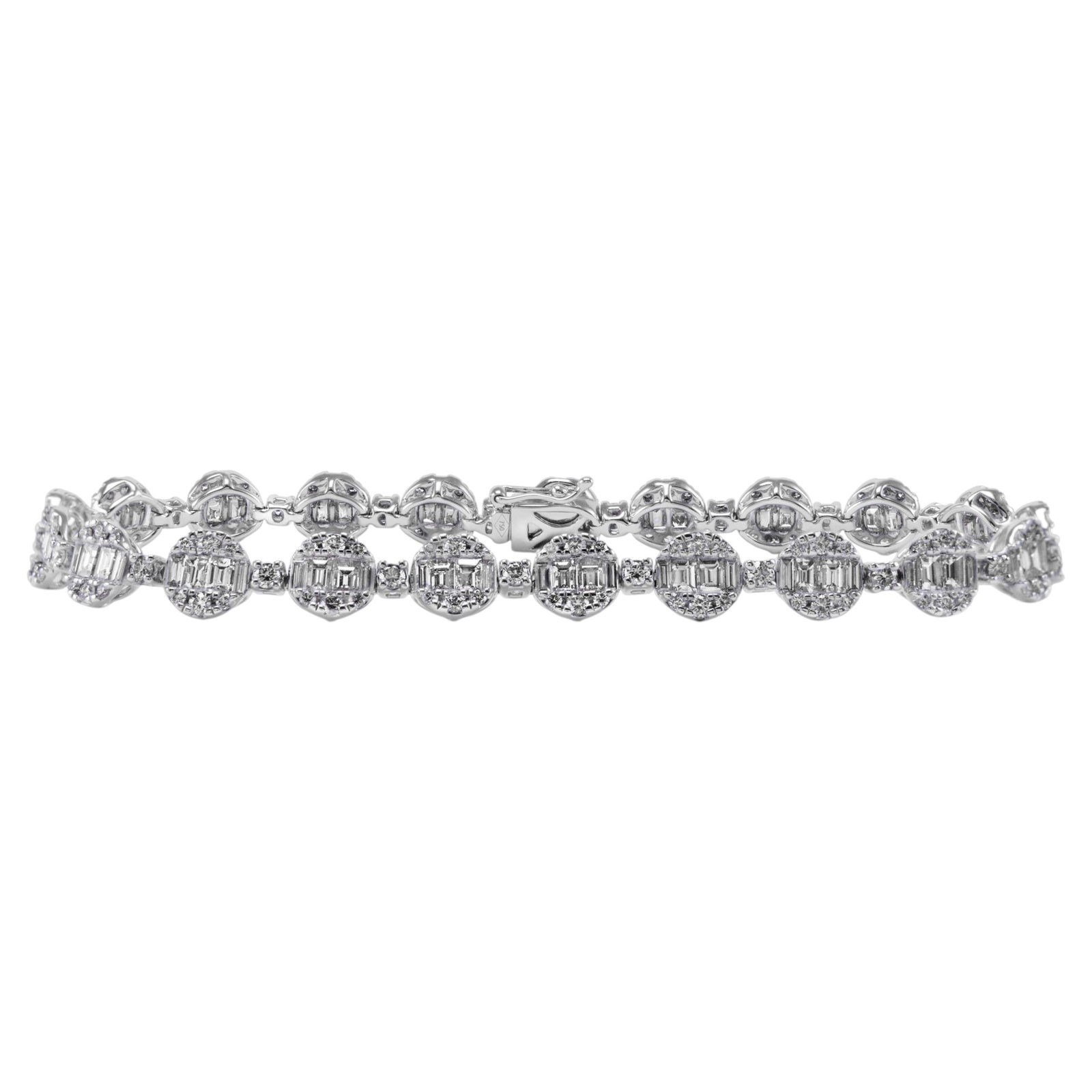 18k White Gold Diamond Illusion Bracelet 5ct: 18k White Gold Diamond Illusion Bracelet 5ct Contemporary illusion-set natural diamond bracelet featuring 231 round and baguette cut diamonds totaling 5.00 carats, crafted in 18k white gold. The diamo