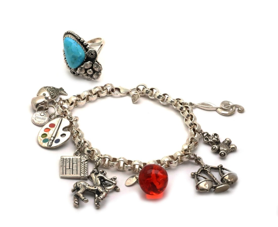 2 Piece Sterling Silver Jewelry Set Charm Bracelet and Turquoise Ring: 2 Piece Sterling Silver Jewelry Set Charm Bracelet and Turquoise Ring This stunning set includes a Vintage Sterling Silver Multi Charm Bracelet and a Floral Ring, both meticulously crafted from sterli