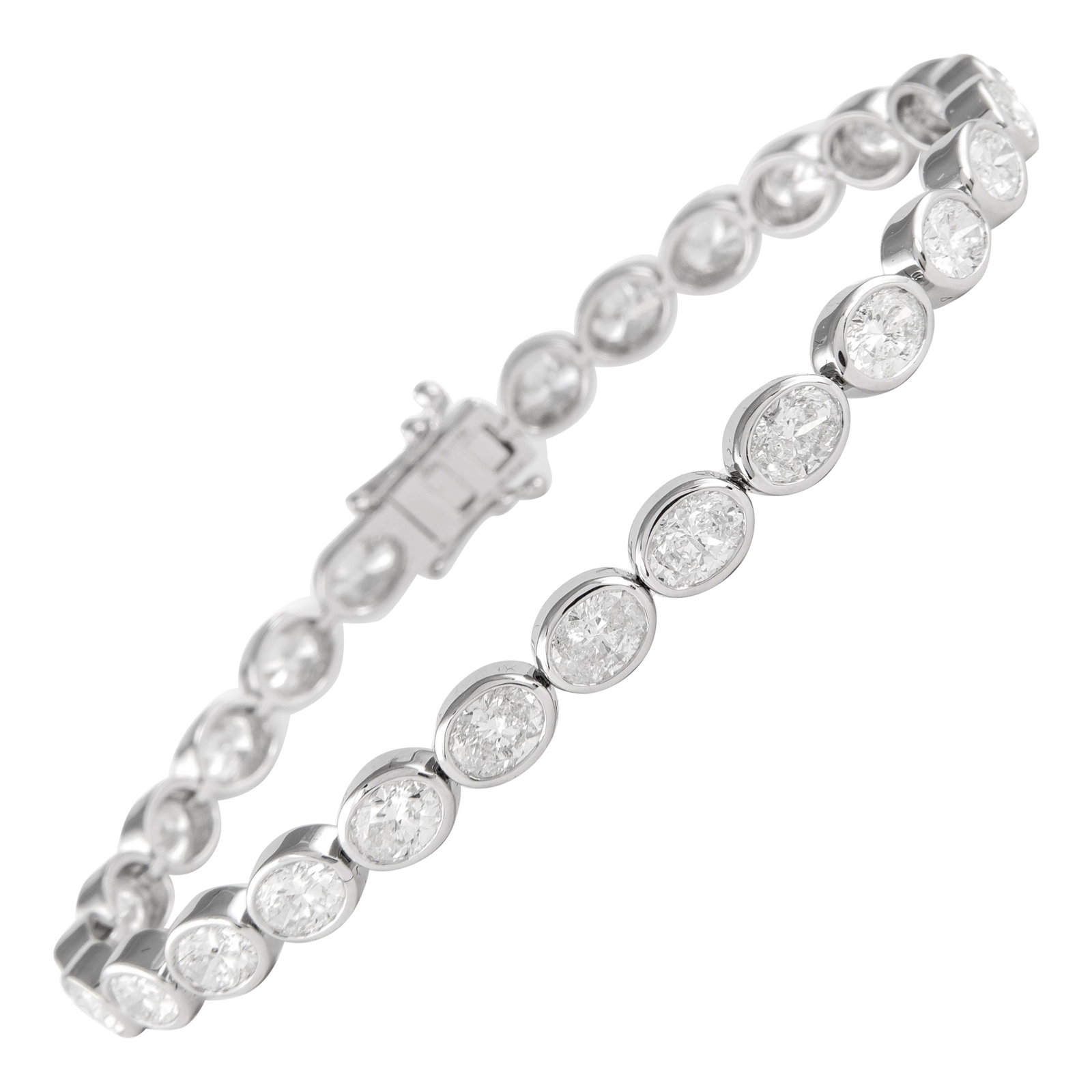 18k White Gold Diamond Tennis Bracelet 8.51ct Oval Bezel: 18k White Gold Diamond Tennis Bracelet 8.51ct Oval Bezel Contemporary east-west bezel set diamond tennis bracelet featuring 27 oval cut white diamonds with a total weight of 8.51 ct. Crafted in 18k wh