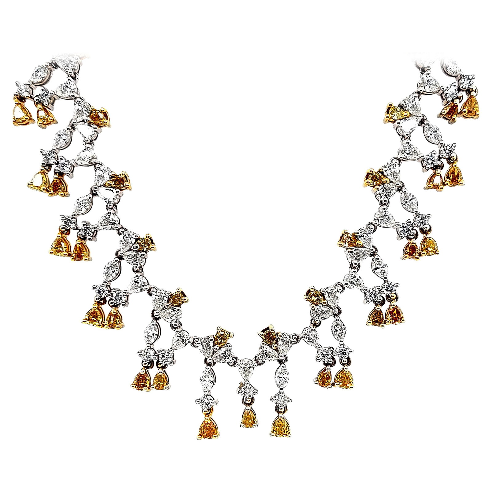 25.17 ct Yellow White Diamond Necklace in 18k Gold: 25.17 ct Yellow White Diamond Necklace in 18k Gold Contemporary grand necklace featuring alternating yellow and white diamonds in an 18k yellow and white gold setting. The necklace is set with pear sh