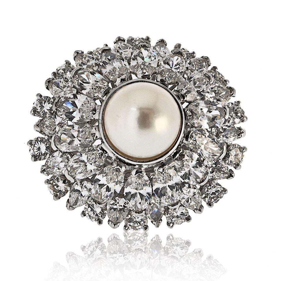 Oscar Heyman Platinum Pearl Ring with 6.00cttw Diamonds: Oscar Heyman Platinum Pearl Ring with 6.00cttw Diamonds Estate Oscar Heyman ring in platinum featuring a round pearl center accented by diamonds in marquise, oval, and round cuts. The design has a sub