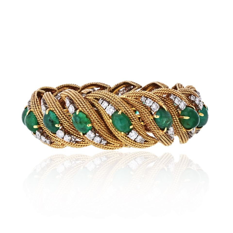 David Webb Emerald Diamond Bracelet in Platinum and 18K Yellow Gold: David Webb Emerald Diamond Bracelet in Platinum and 18K Yellow Gold Vintage David Webb bracelet crafted in platinum and 18K yellow gold, set with cabochon emeralds and round cut diamonds. This pre-own