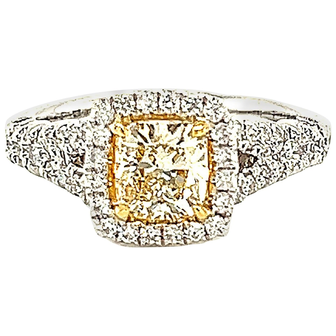 18k Two Tone Halo Ring 1.55ctt Yellow Cushion Diamond: 18k Two Tone Halo Ring 1.55ctt Yellow Cushion Diamond Contemporary halo ring featuring an EGL-certified Fancy Light Yellow cushion-cut diamond center surrounded by white diamonds. Crafted in two-tone 