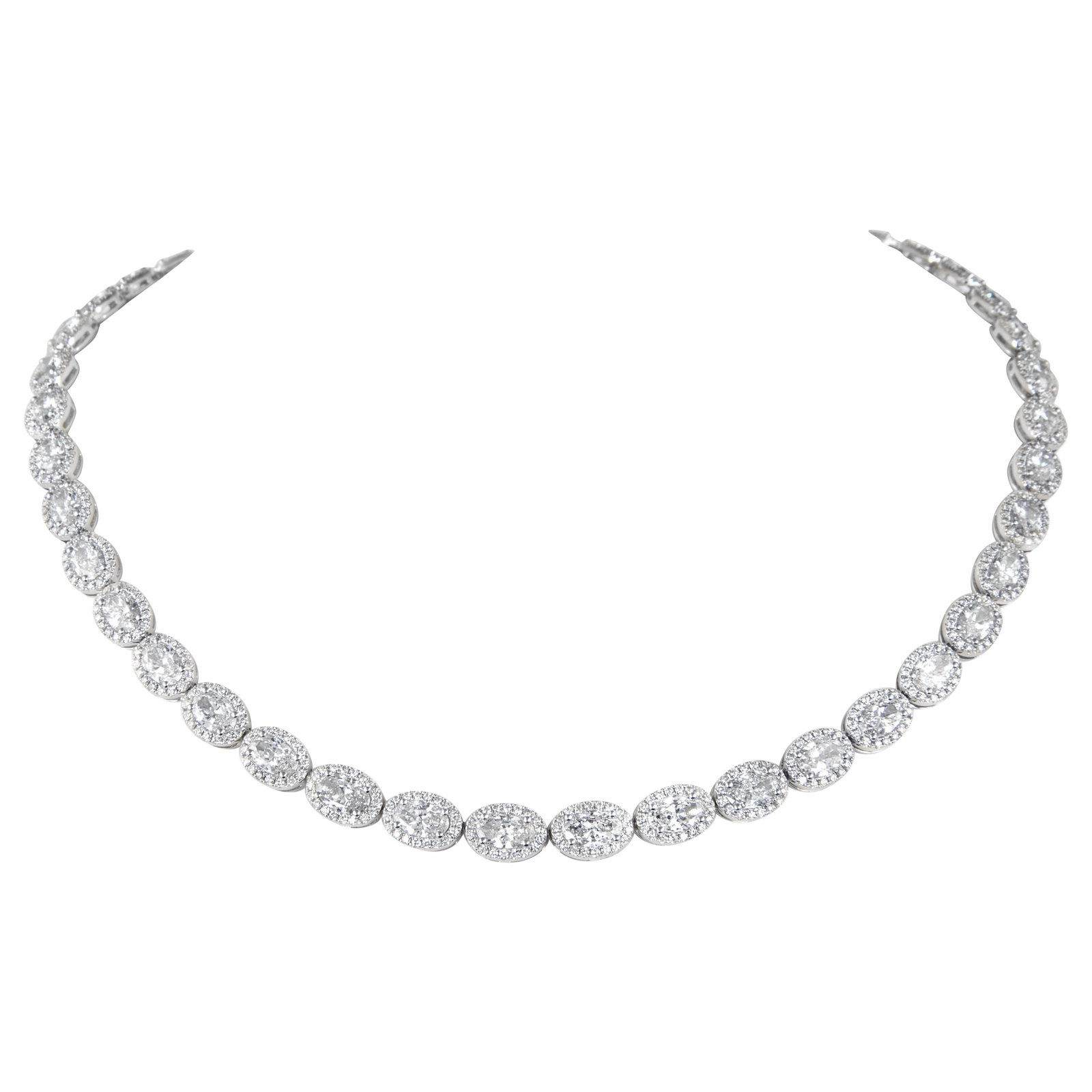 18k White Gold Halo Diamond Tennis Necklace 22.18ct: 18k White Gold Halo Diamond Tennis Necklace 22.18ct Contemporary oval diamond tennis necklace with halo design in 18k white gold. This necklace features 45 natural oval diamonds set east-west and acce