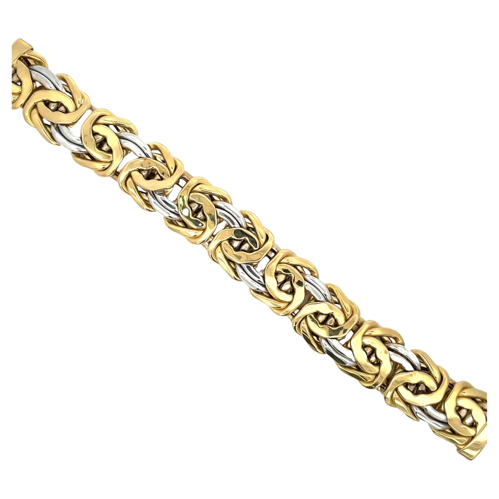 18K Yellow and White Gold Byzantine Style Link Bracelet 31.9g: 18K Yellow and White Gold Byzantine Style Link Bracelet 31.9g Wide Byzantine style motif bracelet crafted in two-tone 18 karat yellow and white gold. This contemporary link bracelet has a substantial 