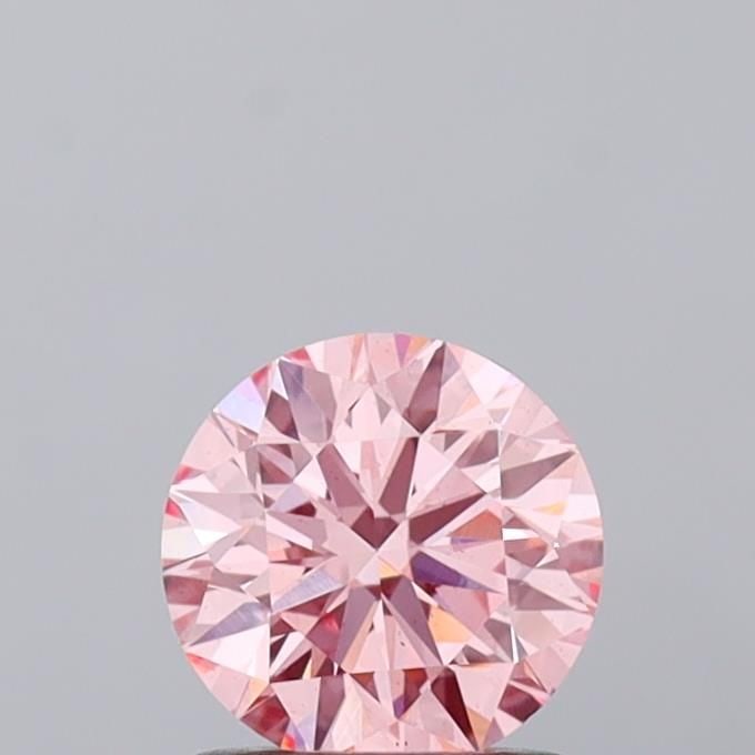 Loose Diamond - ROUND 1.02ct Fancy Vivid Pink VS2: Loose Diamond - ROUND 1.02ct Fancy Vivid Pink VS2 Source: This is a real non-mined Diamond that has been grown in a lab Shape: ROUND Carats: 1.02 Color: Fancy Vivid Pink Certification: IGI Video: