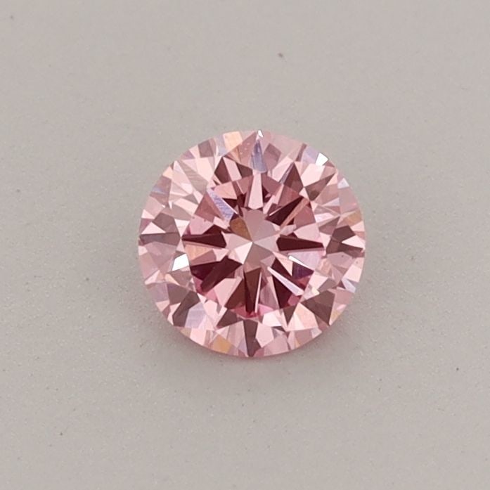 Loose Diamond - ROUND 0.32ct Fancy Vivid Pink VS1: Loose Diamond - ROUND 0.32ct Fancy Vivid Pink VS1 Source: This is a real non-mined Diamond that has been grown in a lab Shape: ROUND Carats: 0.32 Color: Fancy Vivid Pink Certification: IGI PLEASE NOTE