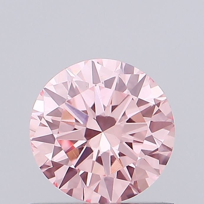 Loose Diamond - ROUND 0.76ct Fancy Vivid Pink VVS2: Loose Diamond - ROUND 0.76ct Fancy Vivid Pink VVS2 Source: This is a real non-mined Diamond that has been grown in a lab Shape: ROUND Carats: 0.76 Color: Fancy Vivid Pink Certification: IGI Video: