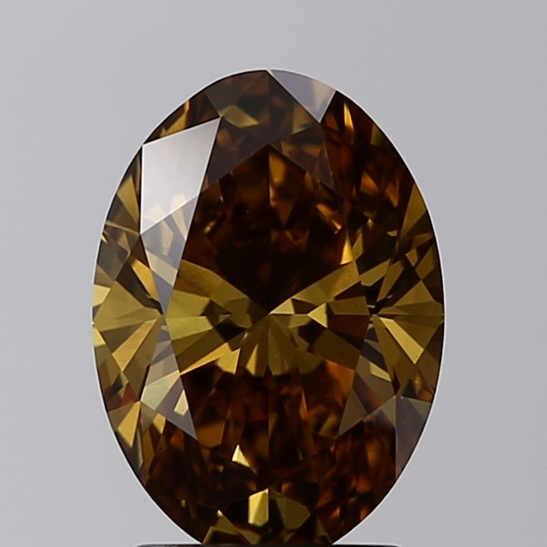 Loose Diamond - OVAL 2.01ct Fancy Vivid Brownish Yellow VS1: Loose Diamond - OVAL 2.01ct Fancy Vivid Brownish Yellow VS1 Source: This is a real non-mined Diamond that has been grown in a lab Shape: OVAL Carats: 2.01 Color: Fancy Vivid Brownish Yellow Certificat