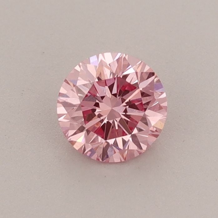 Loose Diamond - ROUND 0.46ct Fancy Vivid Pink VVS2: Loose Diamond - ROUND 0.46ct Fancy Vivid Pink VVS2 Source: This is a real non-mined Diamond that has been grown in a lab Shape: ROUND Carats: 0.46 Color: Fancy Vivid Pink Certification: IGI Video: