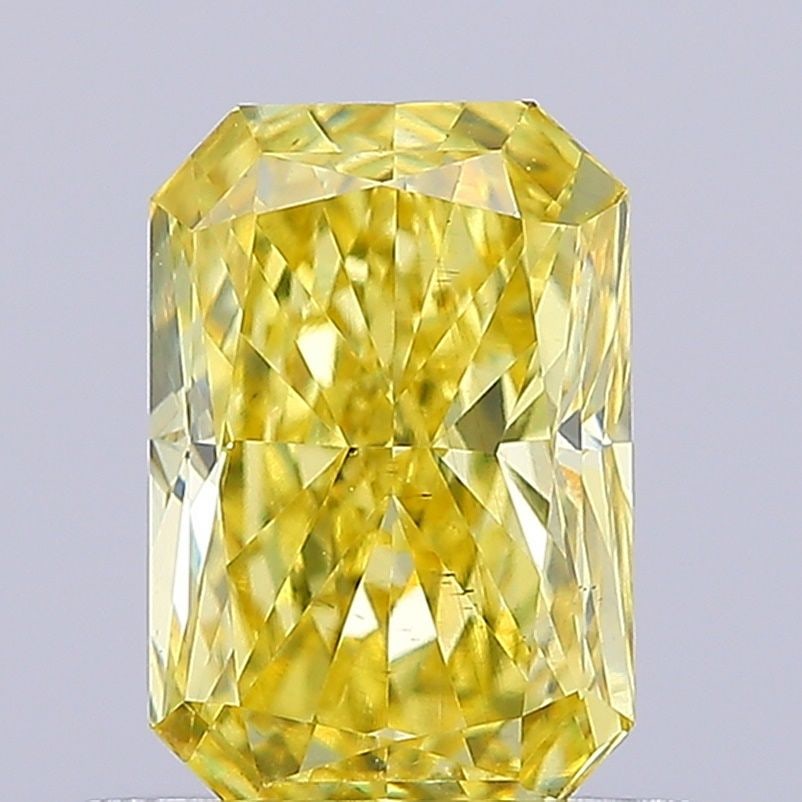 Loose Diamond - RADIANT 0.79ct Fancy Vivid Yellow VS2: Loose Diamond - RADIANT 0.79ct Fancy Vivid Yellow VS2 Source: This is a real non-mined Diamond that has been grown in a lab Shape: RADIANT Carats: 0.79 Color: Fancy Vivid Yellow Certification: IGI Vid