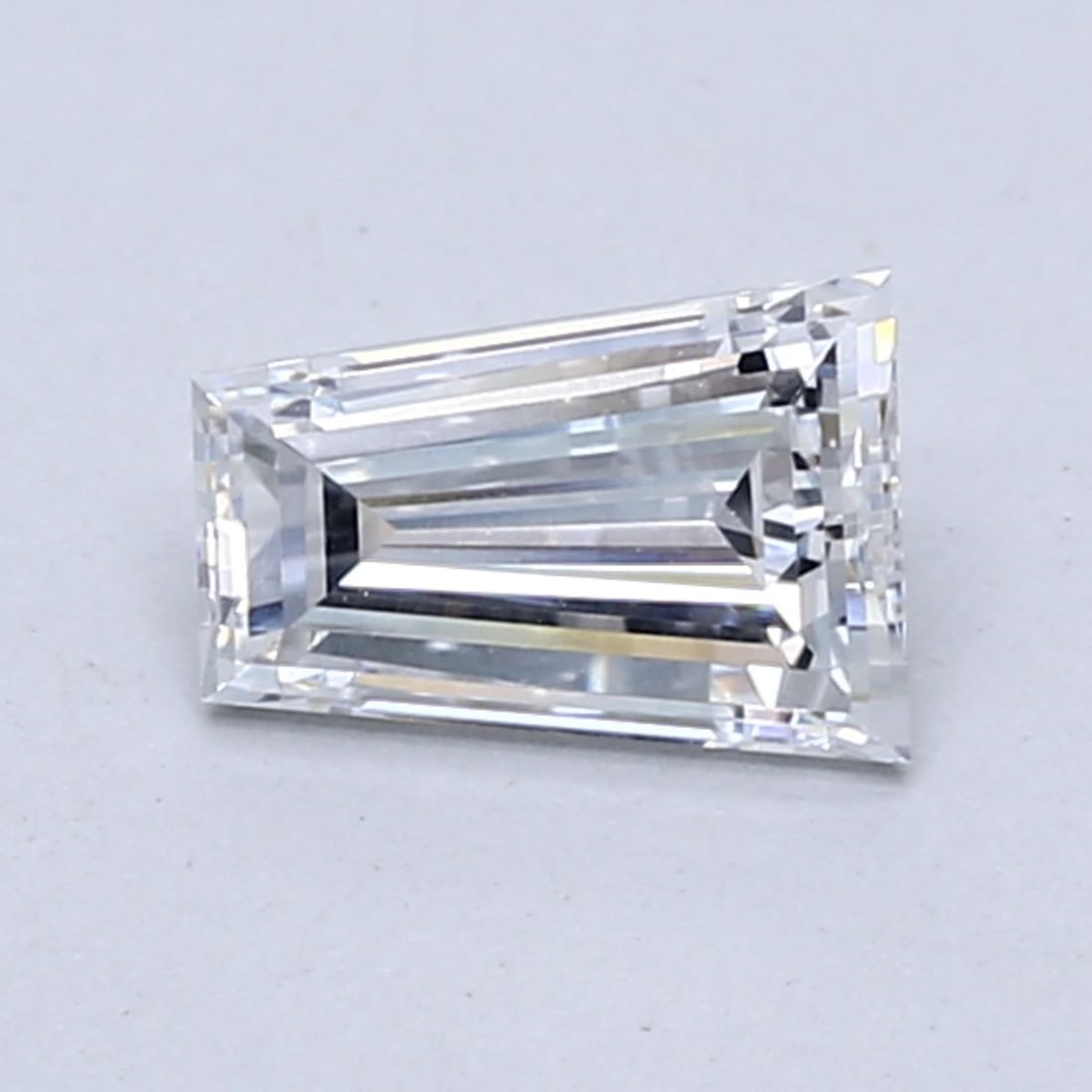 Loose Diamond - TAPERED BAGUETTE 0.73ct E VS1: Loose Diamond - TAPERED BAGUETTE 0.73ct E VS1 Source: This is a real non-mined Diamond that has been grown in a lab Shape: TAPERED BAGUETTE Carats: 0.73 Color: E Clarity: VS1 Certification: NONE Video