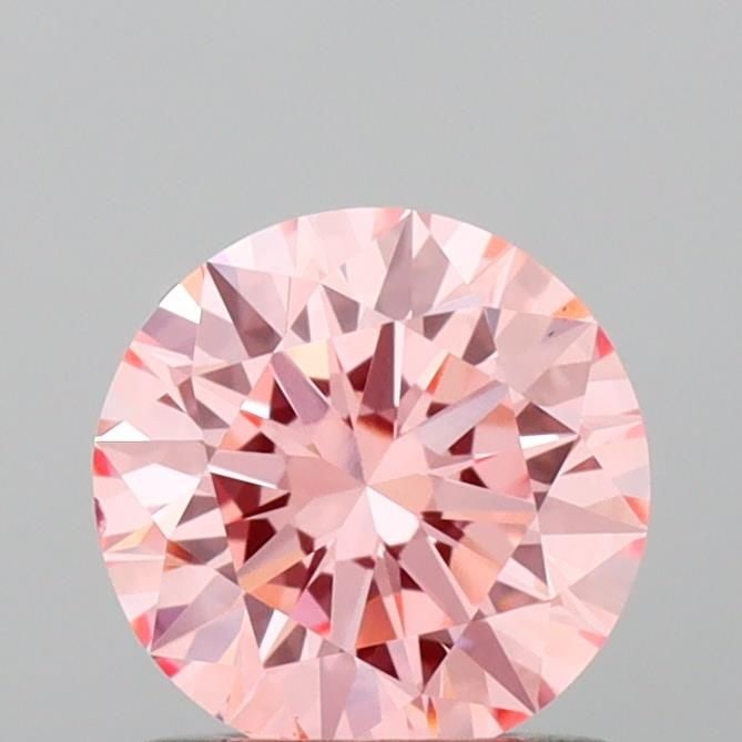Ideal Loose Diamond - ROUND 0.9ct Fancy Vivid Pink VS1: Ideal Loose Diamond - ROUND 0.9ct Fancy Vivid Pink VS1 Source: This is a real non-mined Diamond that has been grown in a lab Shape: ROUND Carats: 0.9 Color: Fancy Vivid Pink Certification: IGI Video: