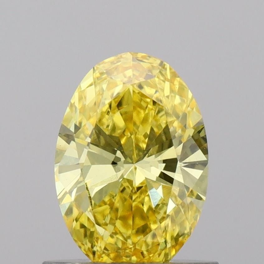 Loose Diamond - OVAL 0.78ct Fancy Vivid Yellow VS2: Loose Diamond - OVAL 0.78ct Fancy Vivid Yellow VS2 Source: This is a real non-mined Diamond that has been grown in a lab Shape: OVAL Carats: 0.78 Color: Fancy Vivid Yellow Certification: IGI Video: