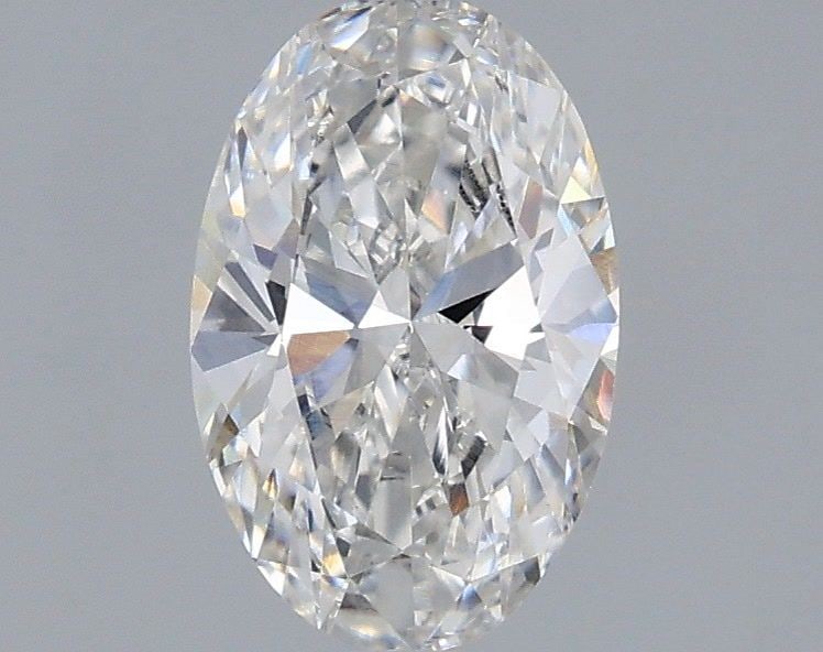 Loose Diamond - OVAL 0.72ct E VVS2: Loose Diamond - OVAL 0.72ct E VVS2 Source: This is a real non-mined Diamond that has been grown in a lab Shape: OVAL Carats: 0.72 Color: E Clarity: VVS2 Certification: IGI Video: