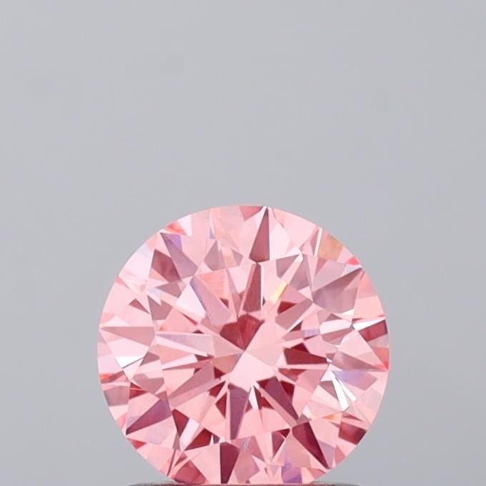 Loose Diamond - ROUND 1.07ct Fancy Vivid Pink VVS2: Loose Diamond - ROUND 1.07ct Fancy Vivid Pink VVS2 Source: This is a real non-mined Diamond that has been grown in a lab Shape: ROUND Carats: 1.07 Color: Fancy Vivid Pink Certification: IGI Video: