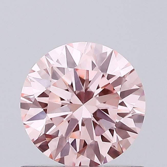 Loose Diamond - ROUND 0.77ct Fancy Vivid Pink VVS2: Loose Diamond - ROUND 0.77ct Fancy Vivid Pink VVS2 Source: This is a real non-mined Diamond that has been grown in a lab Shape: ROUND Carats: 0.77 Color: Fancy Vivid Pink Certification: IGI Video: