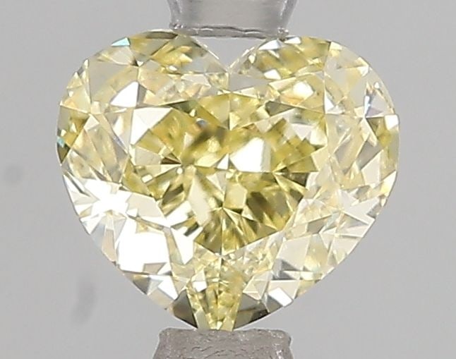 Loose Diamond - HEART 1.51ct Fancy Yellow VVS2: Loose Diamond - HEART 1.51ct Fancy Yellow VVS2 Source: This is a real non-mined Diamond that has been grown in a lab Shape: HEART Carats: 1.51 Color: Fancy Yellow Certification: IGI Video: