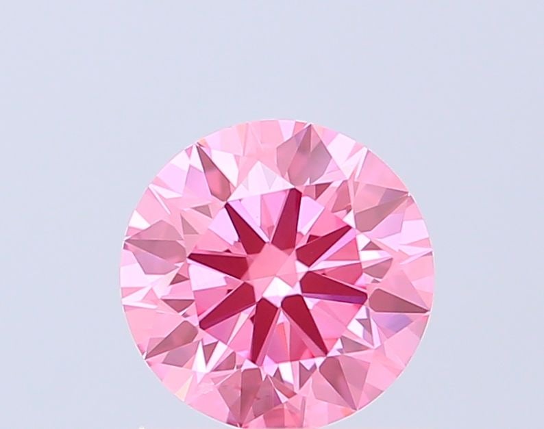 Ideal Loose Diamond - ROUND 0.97ct Fancy Vivid Pink VS1: Ideal Loose Diamond - ROUND 0.97ct Fancy Vivid Pink VS1 Source: This is a real non-mined Diamond that has been grown in a lab Shape: ROUND Carats: 0.97 Color: Fancy Vivid Pink Certification: IGI