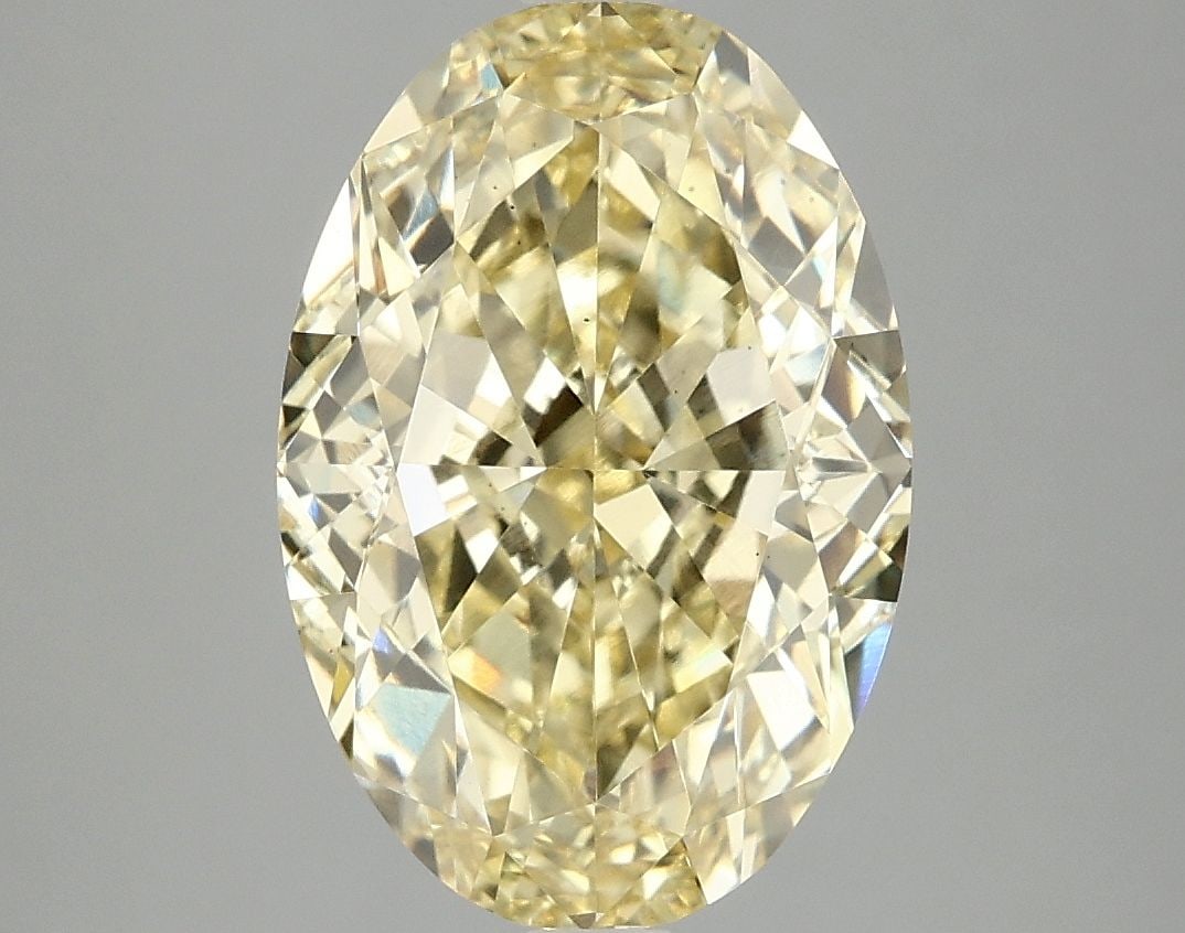 Loose Diamond - OVAL 5.04ct Fancy Vivid Yellow VS2: Loose Diamond - OVAL 5.04ct Fancy Vivid Yellow VS2 Source: This is a real non-mined Diamond that has been grown in a lab Shape: OVAL Carats: 5.04 Color: Fancy Vivid Yellow Certification: IGI Video: